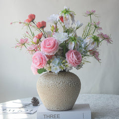 legant Home decor Floral Arrangement  in a cream round vase with pink-white romantic bouquet, styled with books for interior decor display