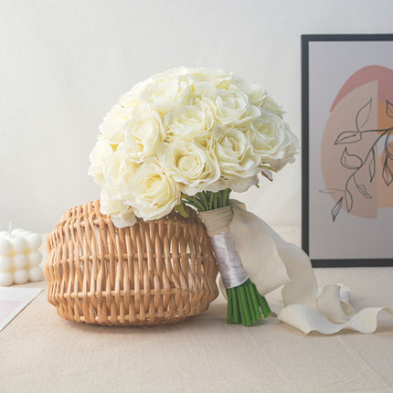 High-Quality artificial cream white silk rose bridal bouquet in a woven basket arrangement.
