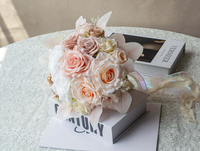 Handmade realistic artificial rose bouquet in soft pastel colors, beautifully arranged on a table.