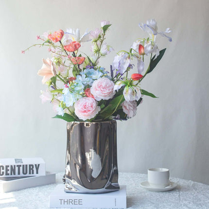 Realistic artificial Peony flower arrangement in decorative vase with assorted flowers, ideal for table decor.