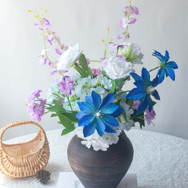 Handmade Clematis realistic artificial flower bouquet in a vase with colorful blooms and greenery.