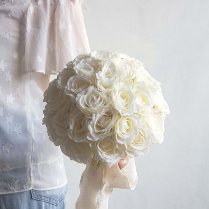 High-Quality artificial cream white silk rose bridal bouquet held by a person, with vibrant cream white silk roses.