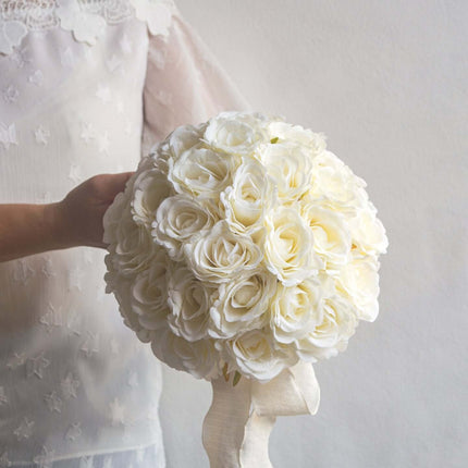 High-Quality artificial cream white silk rose bridal bouquet held by a bride, showcasing elegant silk roses.