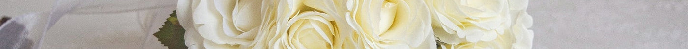 Handmade realistic rose Artificial bouquet featuring white rose flowers arranged elegantly.