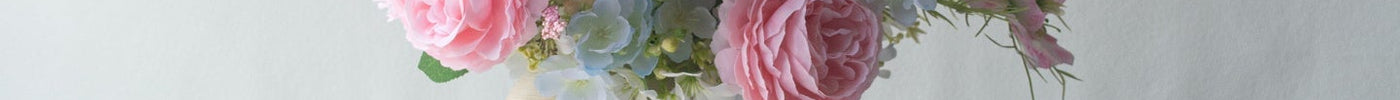 Handmade Spring Pink Artificial Flowers arrangement in a vase with pink and white flowers.