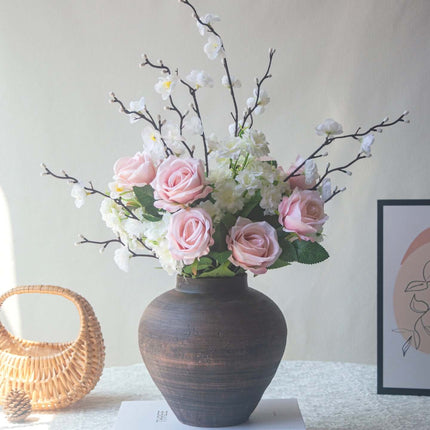 Handmade artificial rose plum blossom arrangement in a decorative vase for home decor.