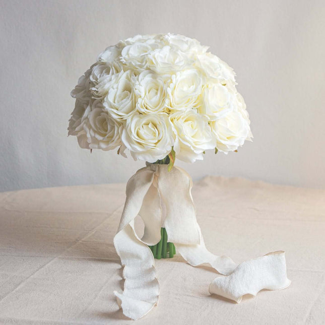 High-Quality artificial cream white silk rose bridal bouquet with a delicate ribbon.
