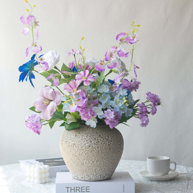 Handmade Clematis realistic artificial flower bouquet in a decorative vase with colorful flowers.