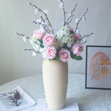 Handmade artificial rose plum blossom arrangement in a vase for home decor.