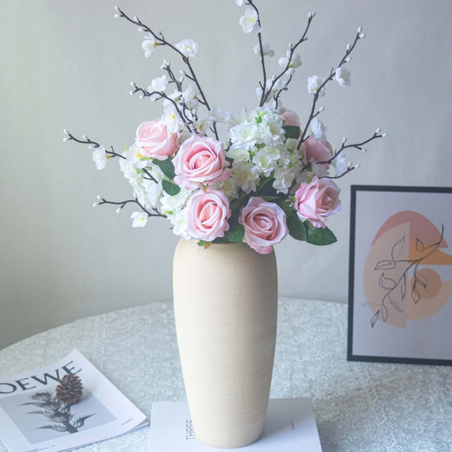 Handmade artificial rose plum blossom arrangement in a vase for home decor.