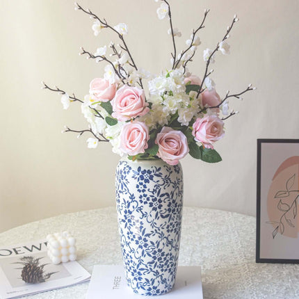 Handmade artificial rose plum blossom arrangement in a blue and white vase for home decor.